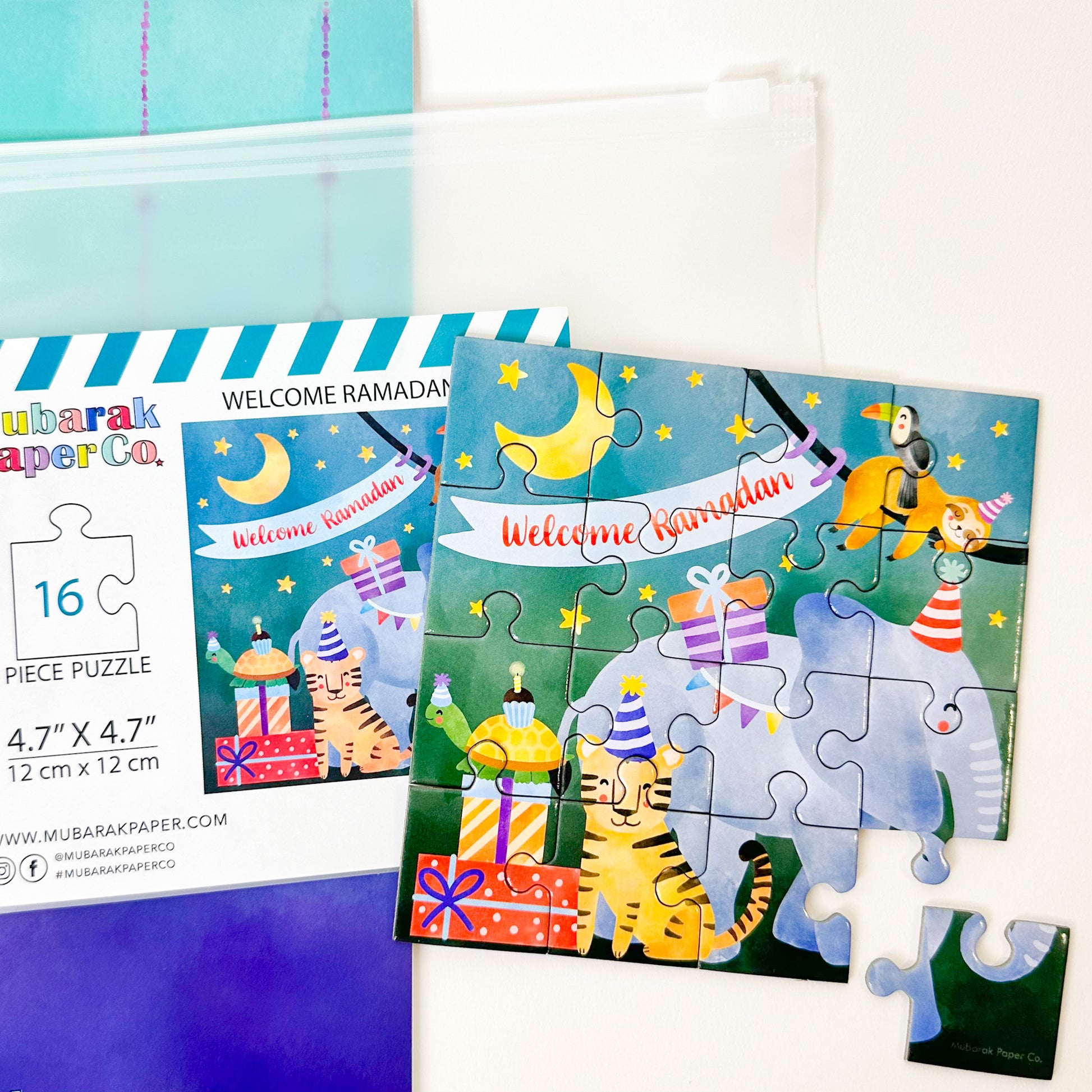 A colorful jigsaw puzzle depicting a festive Ramadan theme with cartoon animals, including an elephant and a cat, and various Ramadan-related decorations.