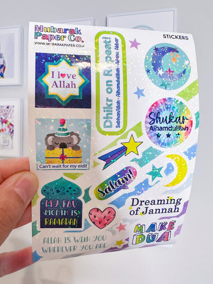 Pack of stickers with religious-themed designs held by a hand