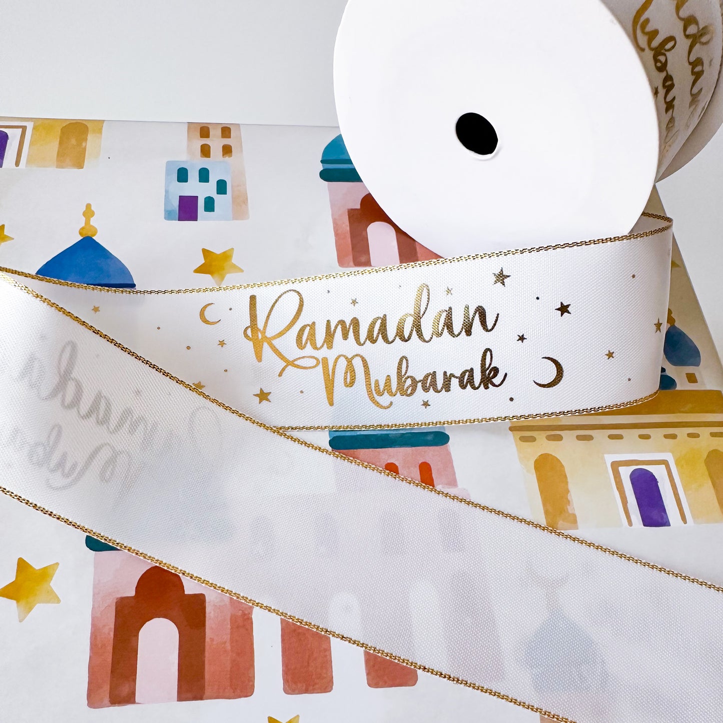 Decorative ribbon with 'Ramadan Mubarak' text 